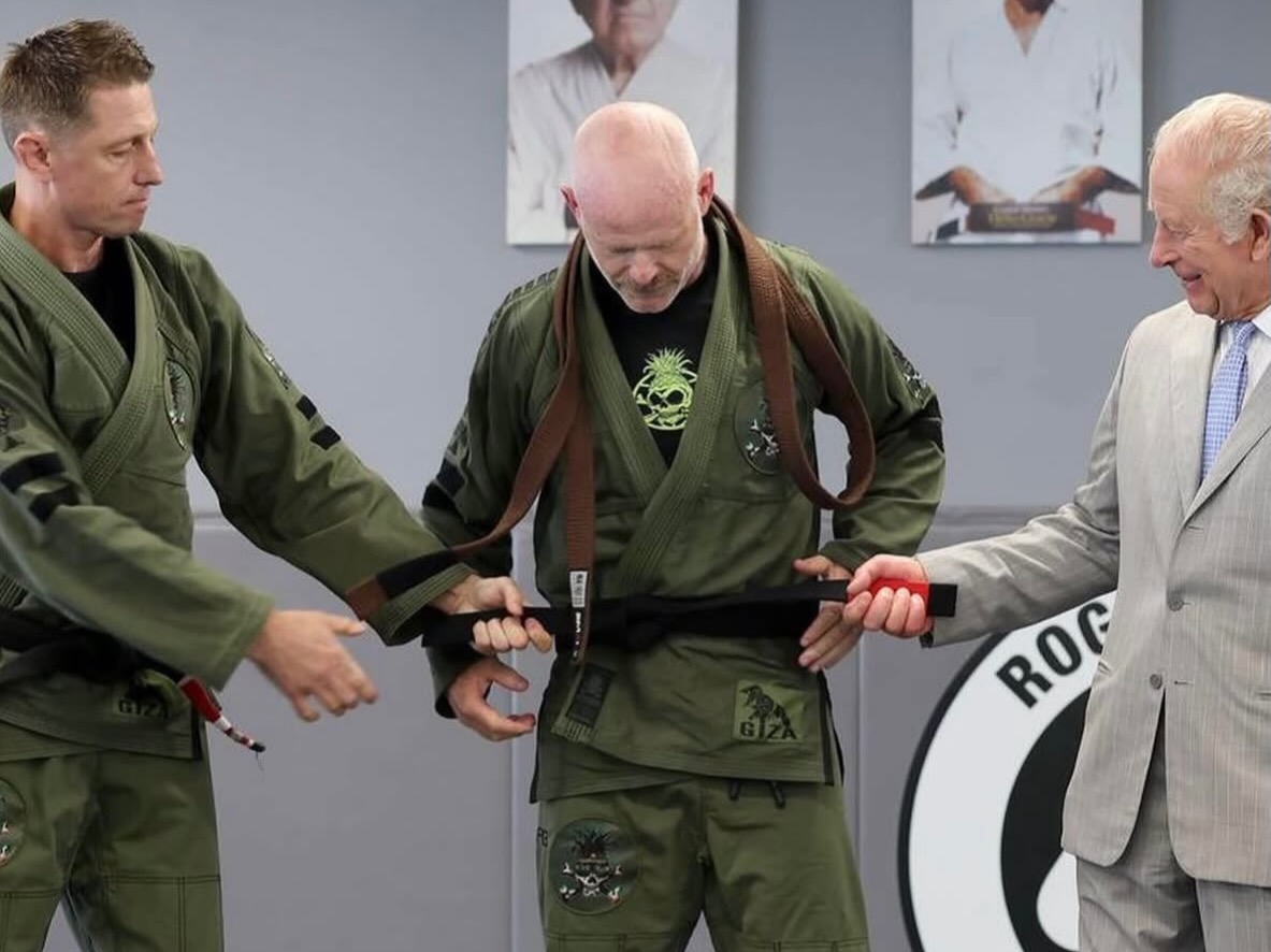 Trent Scanlen receiving his Brazilian jiu-jitsu black belt from King Charles